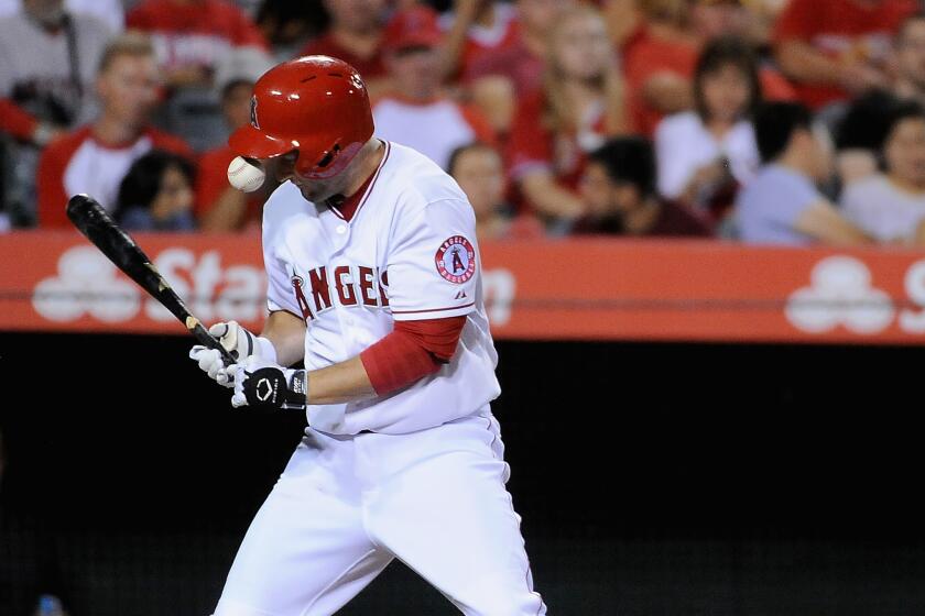 Angels third baseman David Freese is injured July 22 by a pitched ball that hit him in the hand, fracturing his right index finger. The Angels were playing Minnesota in Anaheim.