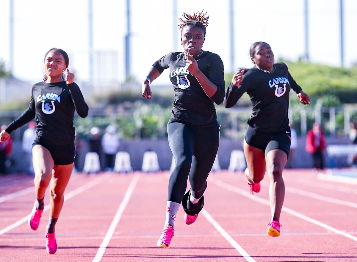 Reign Redmond of Carson leads a 1-2-3 win in the 100 yards.