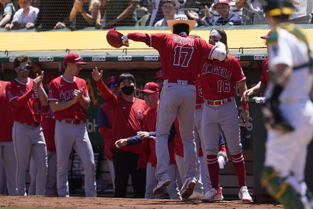 Shohei Ohtani puts on the Angels' celebratory cowboy hat after his two-run home run against the Athletics.