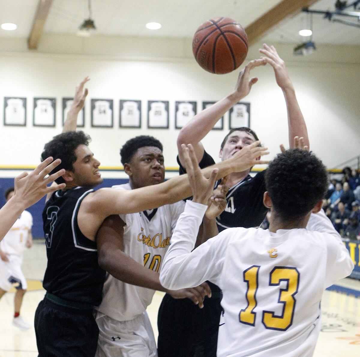 Santa Clara High's Christian Oliver (10) has the ball taken away by Sage Hill's Ryan Hosseinzadeh (3) and Johnny King in the quarterfinals of the CIF State Southern California Regional Division V playoffs on Thursday.