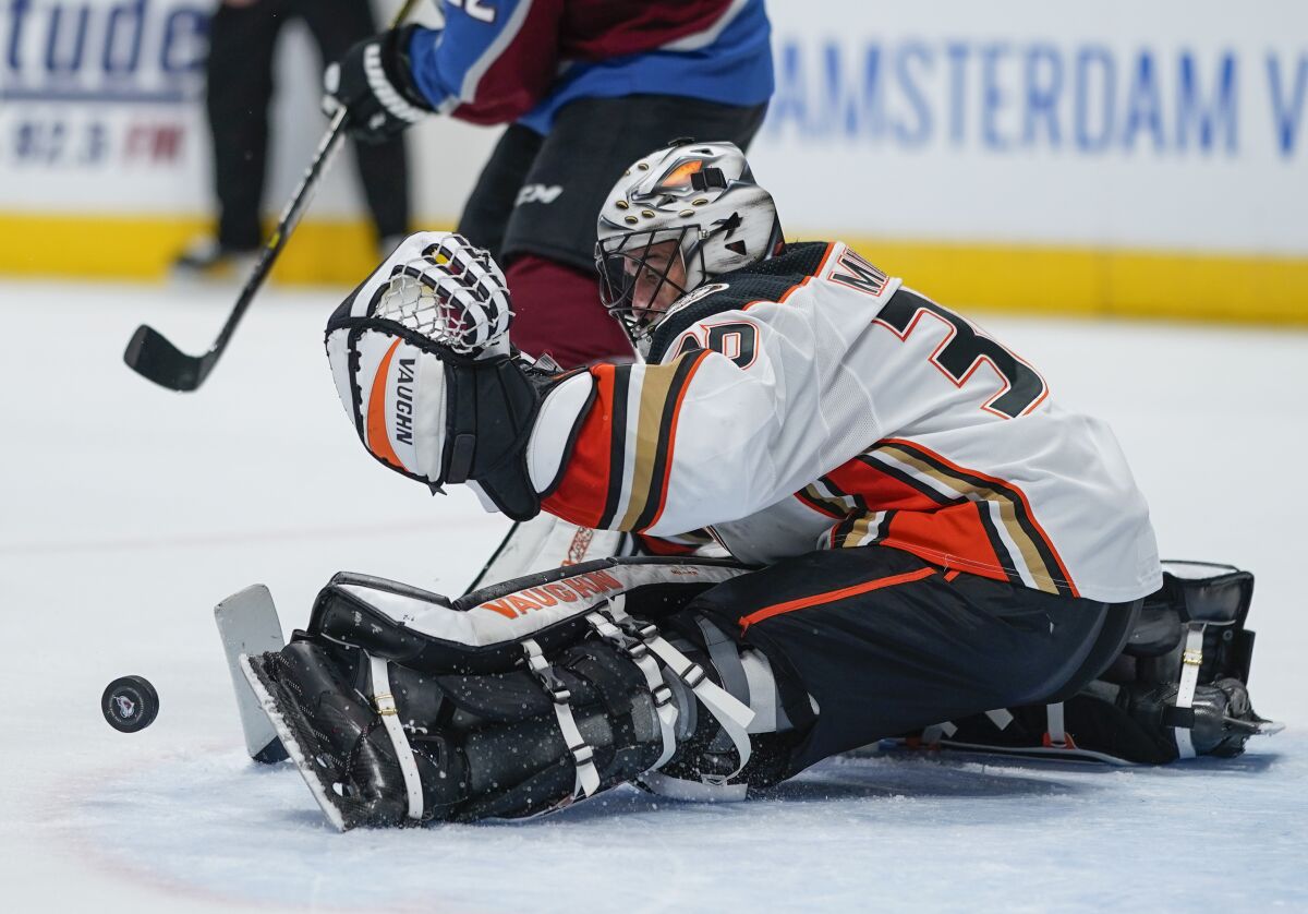 Ducks goaltender Ryan Miller makes a save against the Avalanche during the third period Saturday night.