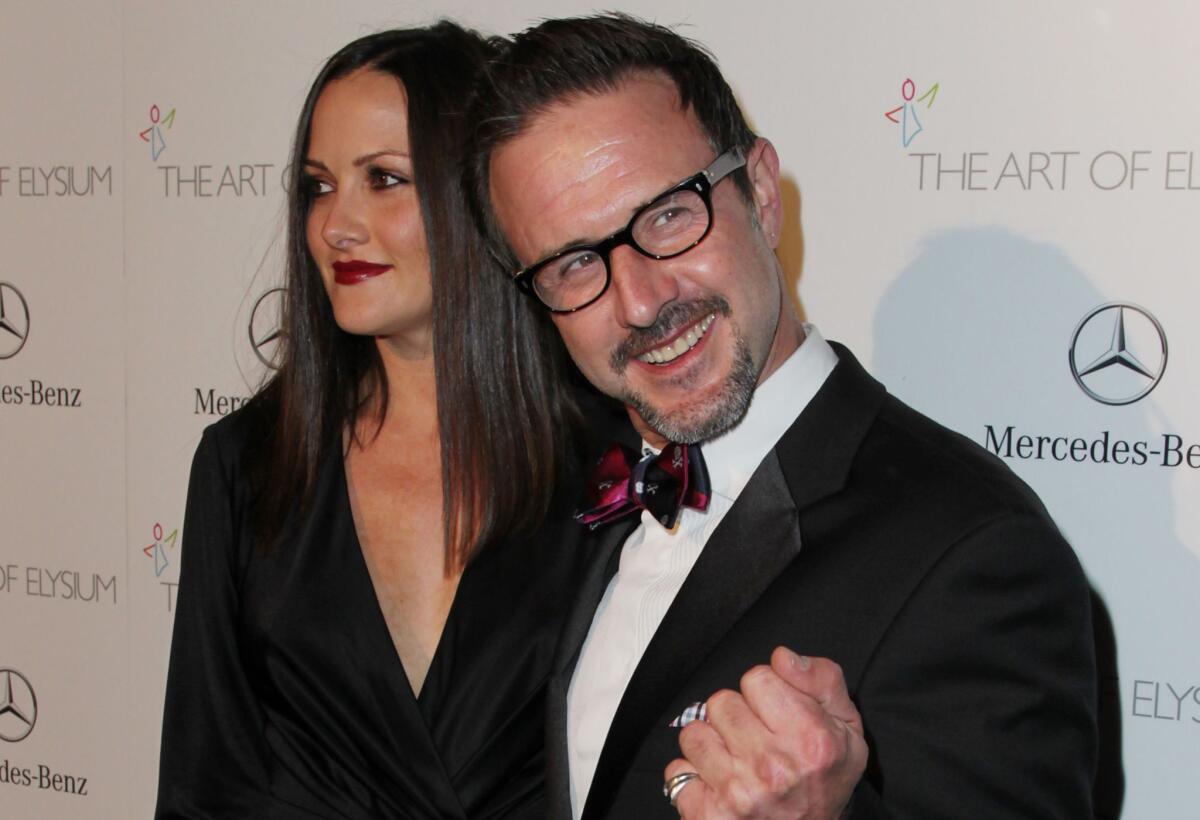 Christina McLarty and David Arquette attend the Art of Elysium's 7th Annual HEAVEN Gala in L.A. in January. They welcomed a son on Monday.
