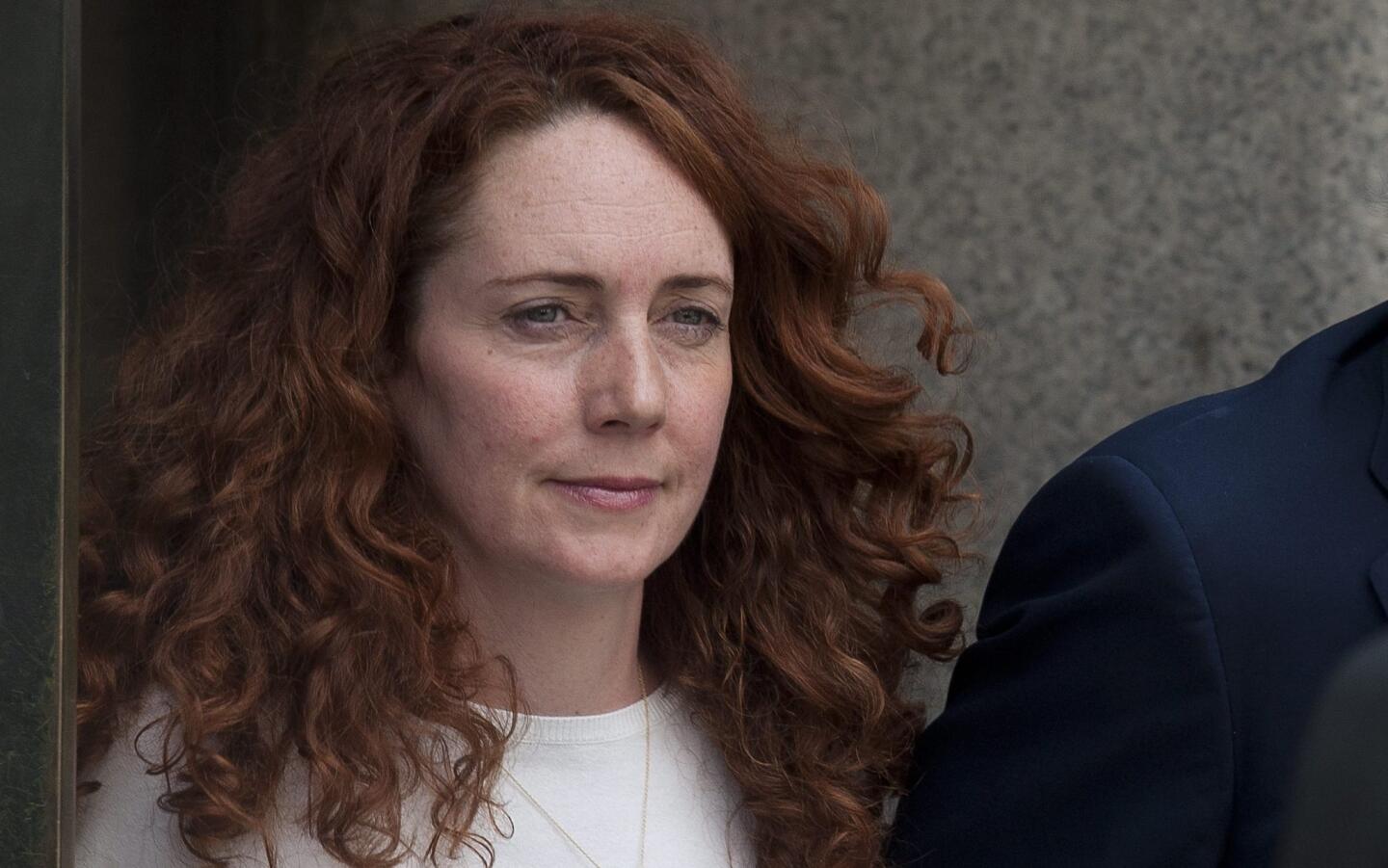 Rebekah Brooks leaves London's Old Bailey courthouse after verdicts were delivered Tuesday in a landmark phone-hacking trial.