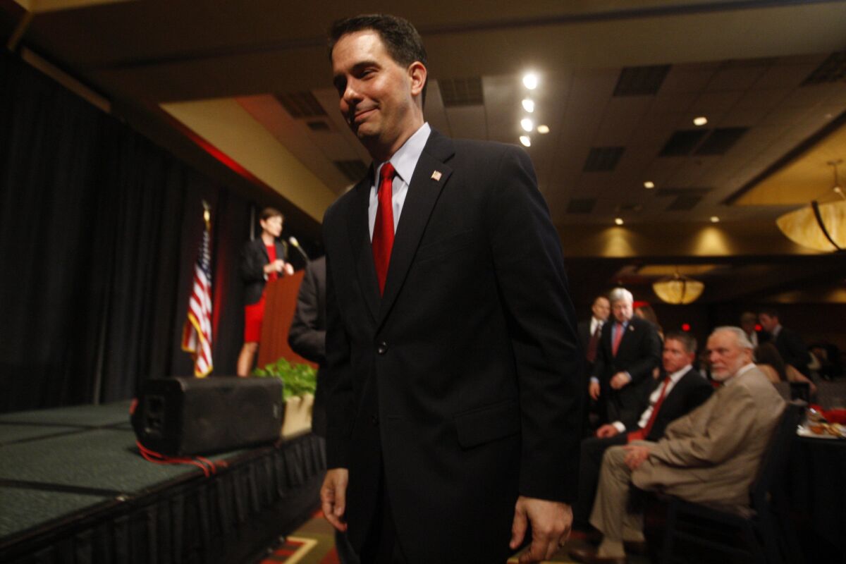 Wisconsin Gov. Scott Walker signed off on abortion restrictions in a discrete manner.
