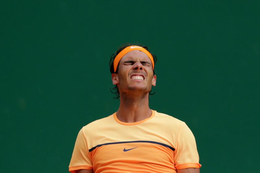 Rafael Nadal of Spain celebrates after his victory over Gael Monfils of France, 7-5, 5-7, 6-0, for his ninth Monte Carlo Masters title on April 17.