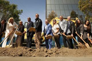 LOS ANGELES, CA - JULY 06: Los Angeles Mayor Eric Garcetti, center, Councilmember Paul Koretz, right, and Kevin Murray, left, President and CEO of the Weingart Center and officials participated in a groundbreaking ceremony for a five-story permanent supportive housing development for seniors and senior veterans who are experiencing homelessness. The development, 11010 Santa Monica Blvd. on the Westside of Los Angeles, will provide 50 affordable studio units and on on- site management unit. The complex will feature a host of amenities, including a rooftop deck and security. JPMorgan Chase provided financing to support construction, according to contact. Westside on Tuesday, July 6, 2021 in Los Angeles, CA. (Al Seib / Los Angeles Times).