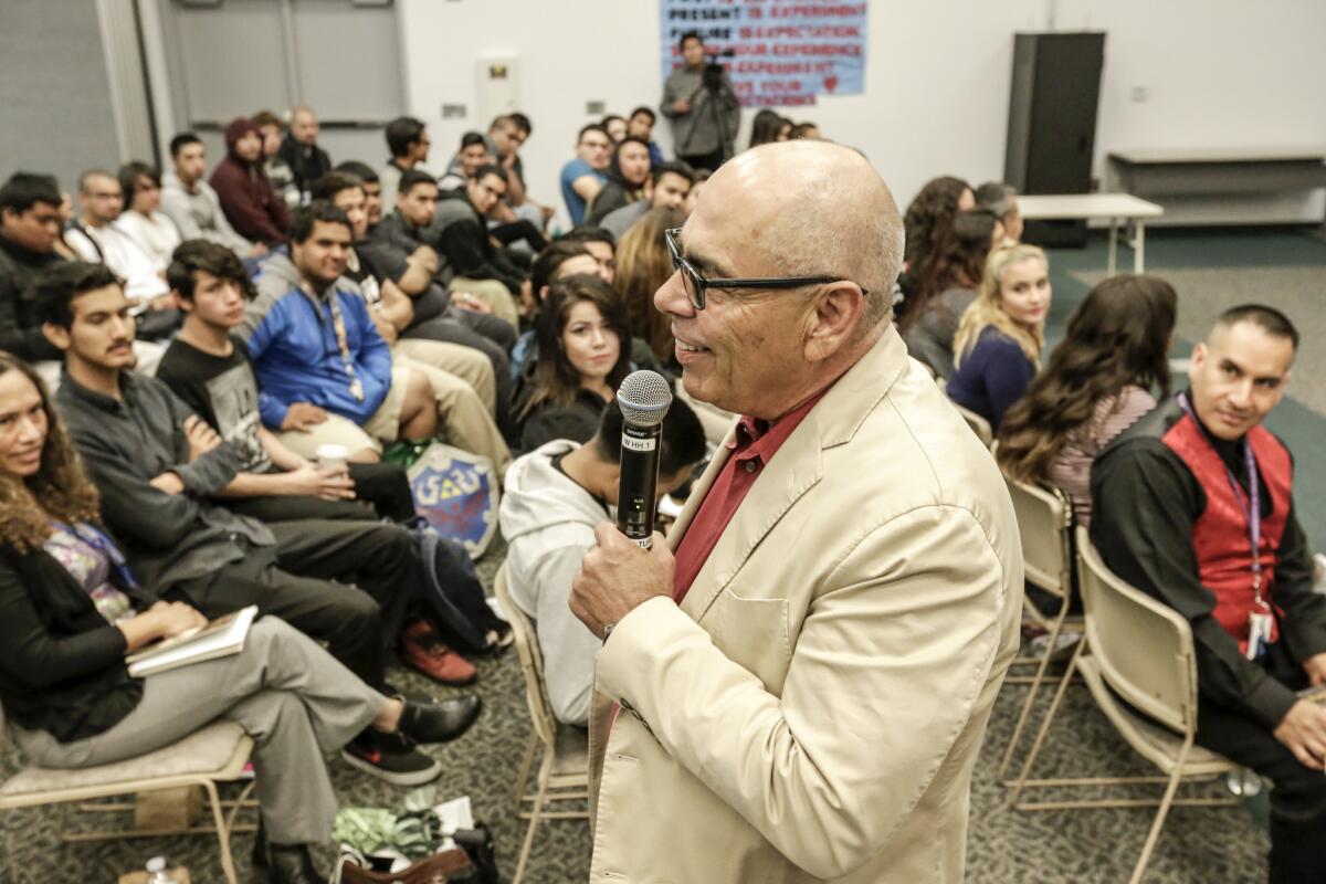 Poet Jimmy Santiago Baca talks to students at the Village Learning Complex about his experience of writing while incarcerated.