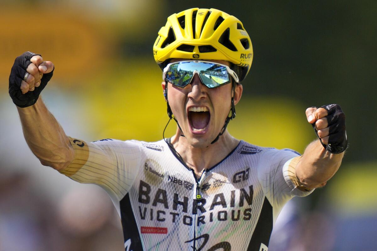 Pello Bilbao raises his arms in triumph after winning Stage 10 of the Tour de France.