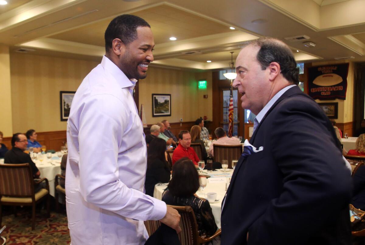 Robert Horry, former NBA basketball player and winner of seven NBA championship titles is welcomed by Spiro Psaltis to the YMCA Quarterback Club Meeting at the Oakmont Country Club banquet facility in Glendale, Ca., Tuesday, October 15, 2019. (photo by James Carbone)