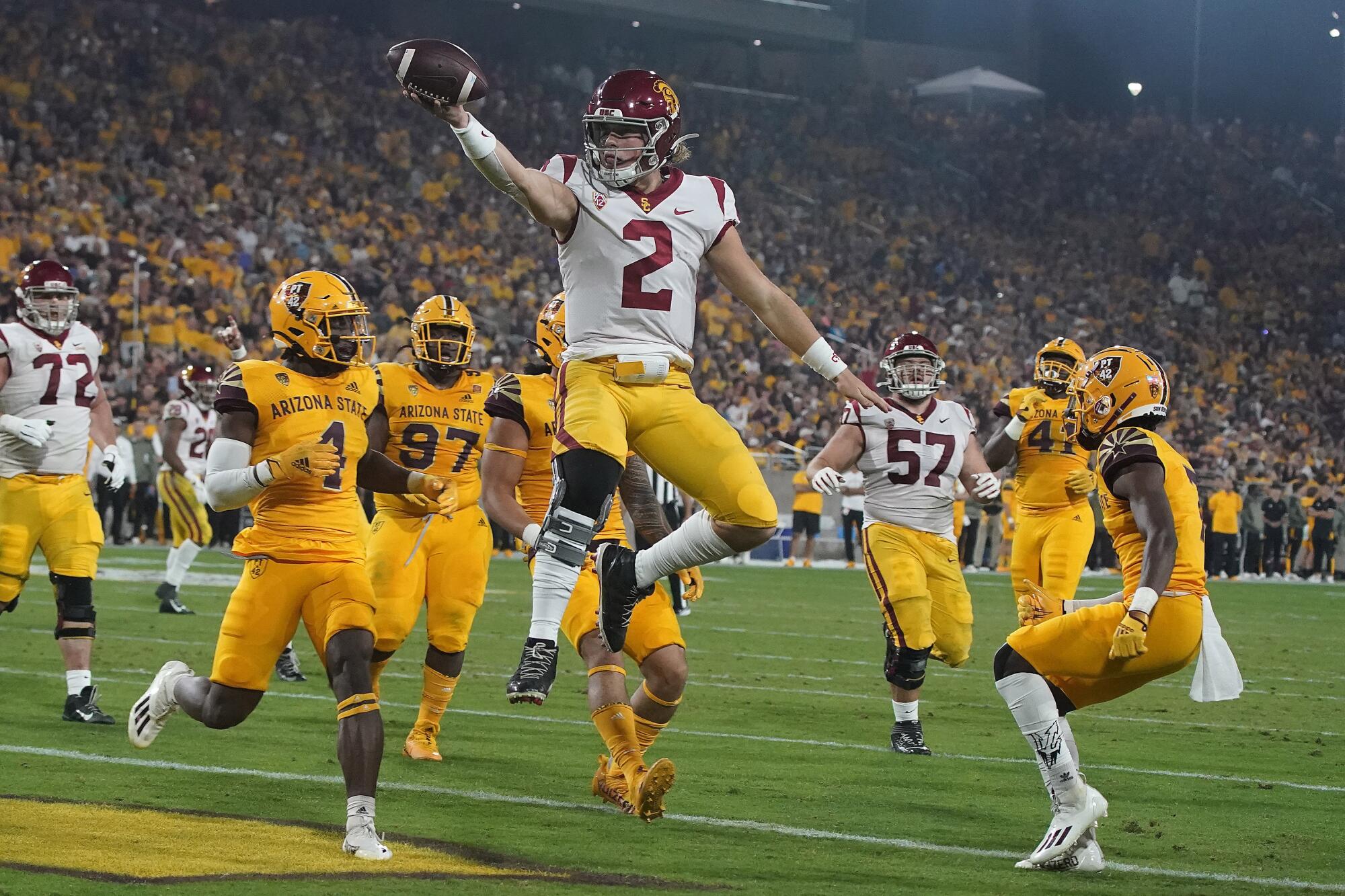 USC quarterback Jaxson Dart celebrates after running for a touchdown against Arizona State 
