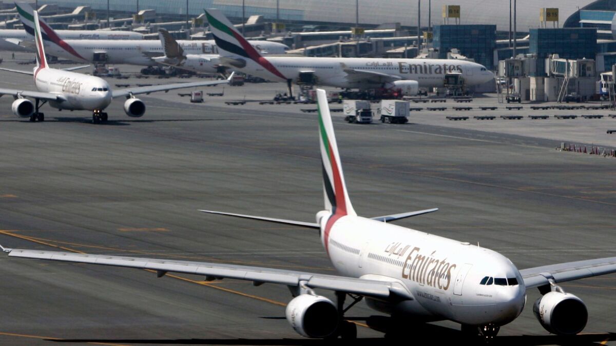 Emirates jets taxi on the tarmac at Dubai International Airport. Several U.S.-based carriers say Emirates has an unfair advantage because it is supported by its oil-rich government owners.