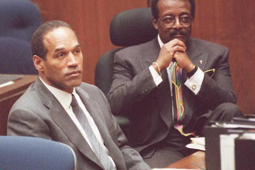 The first season of "American Crime Story" will revisit O.J. Simpson's murder trial. Simpson, left, is seen here during that 1995 trial with defense attorney Johnnie L. Cochran Jr.