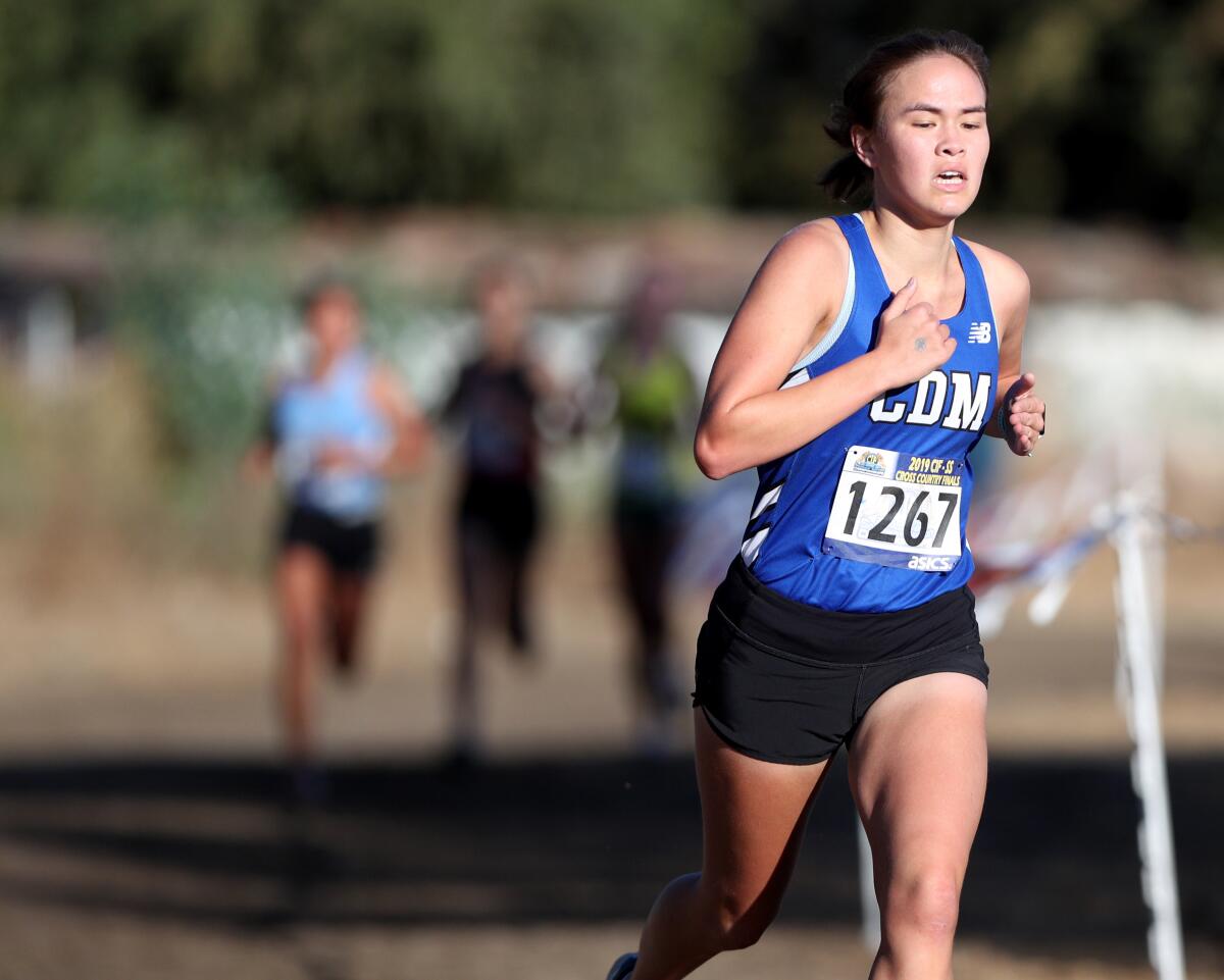 Corona del Mar's Maya Buchwald runs in the CIF Southern Section Division 3 final at the Riverside City Cross-Country Course on Nov. 23.