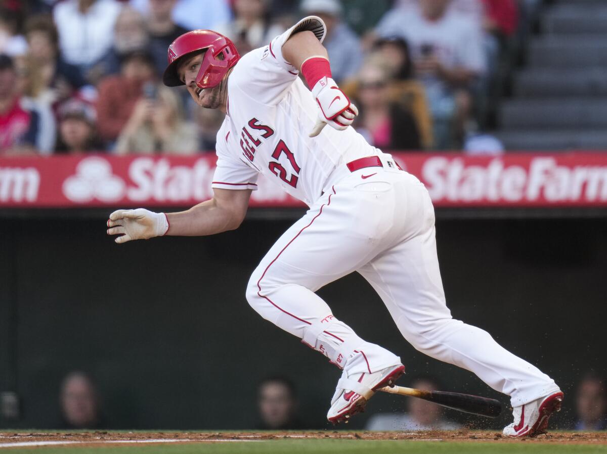 The Angels' Mike Trout runs to first base after hitting a single 