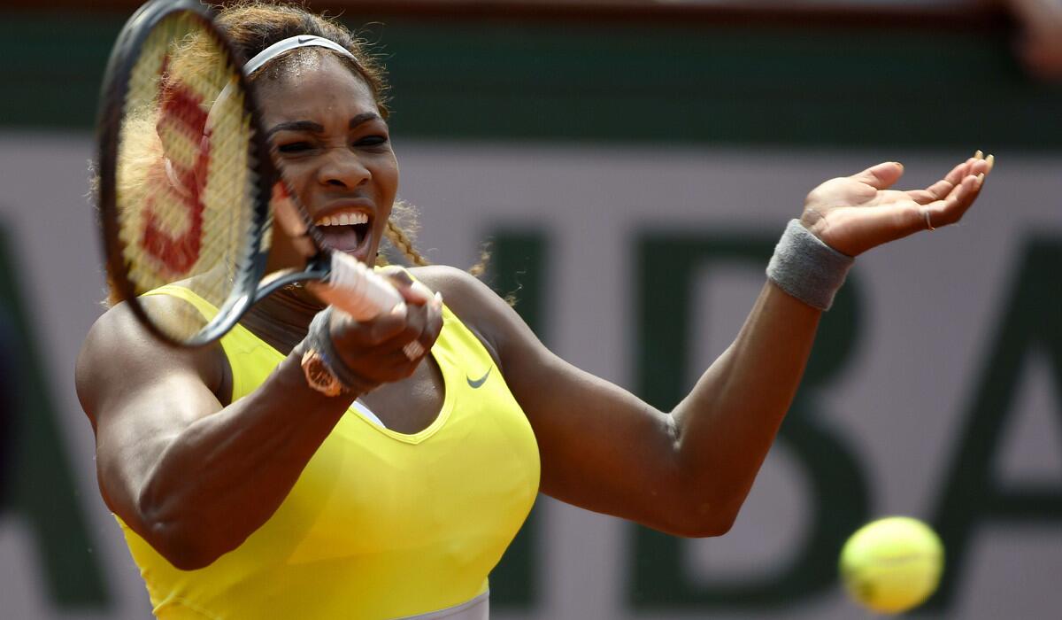 Serena Williams gets into a forehand during her straight-set victory over Alize Lim in a first-round match at the French Open on Sunday.