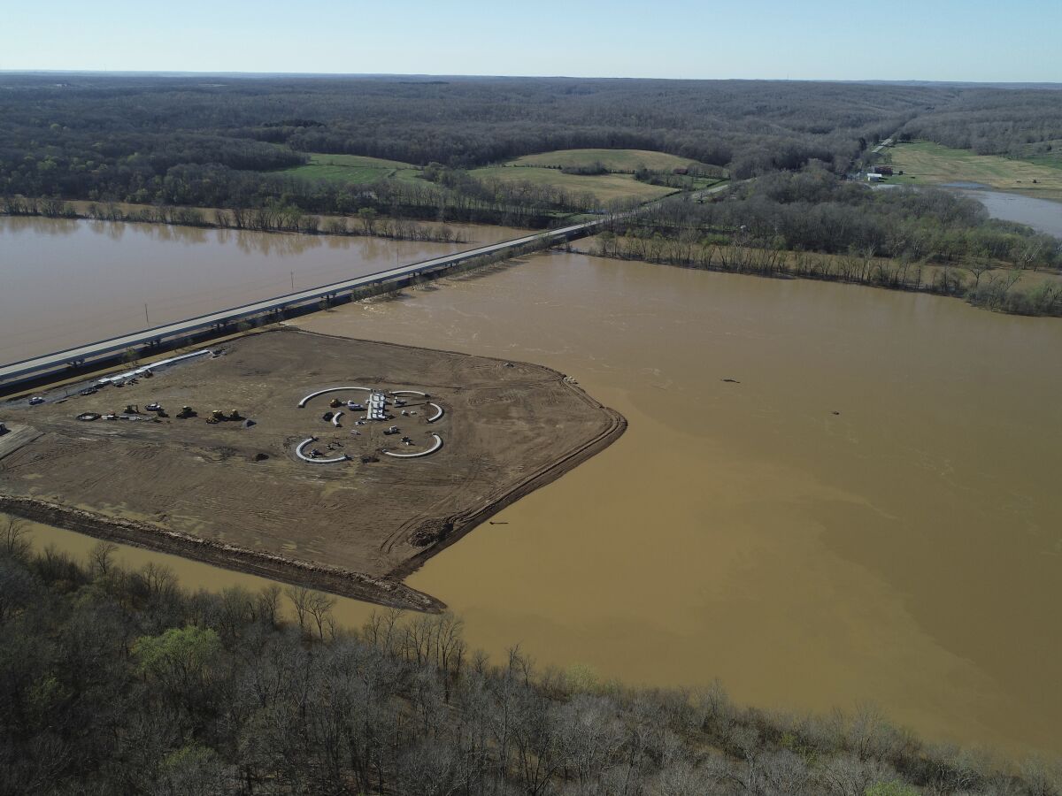 This photo taken on March 29, 2001, shows a light-colored plume extending from a controversial sand and gravel mine on the Duck River in Tennessee. Volunteer Sand and Gravel has been ignoring a cease and desist letter for months, and opponents say its continued construction on the banks of North America's most biodiverse river may already be harming wildlife. ( Matt Reed/BDY via AP)