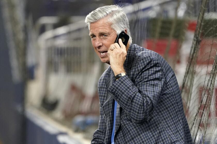Philadelphia Phillies President of Baseball Operations Dave Dombrowski talks on his phone before a baseball game