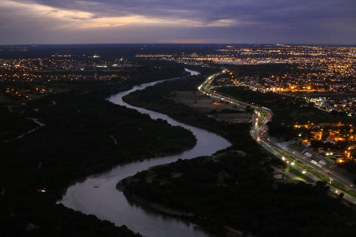 The Rio Grande River separates Laredo, Texas, left, and Nuevo Laredo, Mexico.