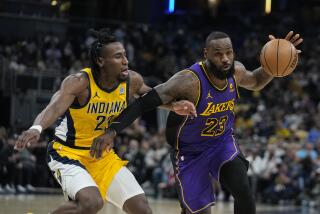 Los Angeles Lakers' LeBron James (23) goes to the basket against Indiana Pacers' Aaron Nesmith (23) during the first half of an NBA basketball game Friday, March 29, 2024, in Indianapolis. (AP Photo/Darron Cummings)