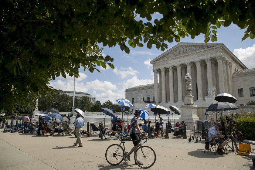 Members of the media set up outside the Supreme Court in July 2020, 