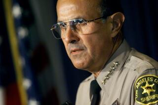 ME.Baca.2.1207.AR Los Angeles County Sheriff Lee Baca held a press conference, 12/7/99, at his headquarters in Monterey Park to mark his first year in office.