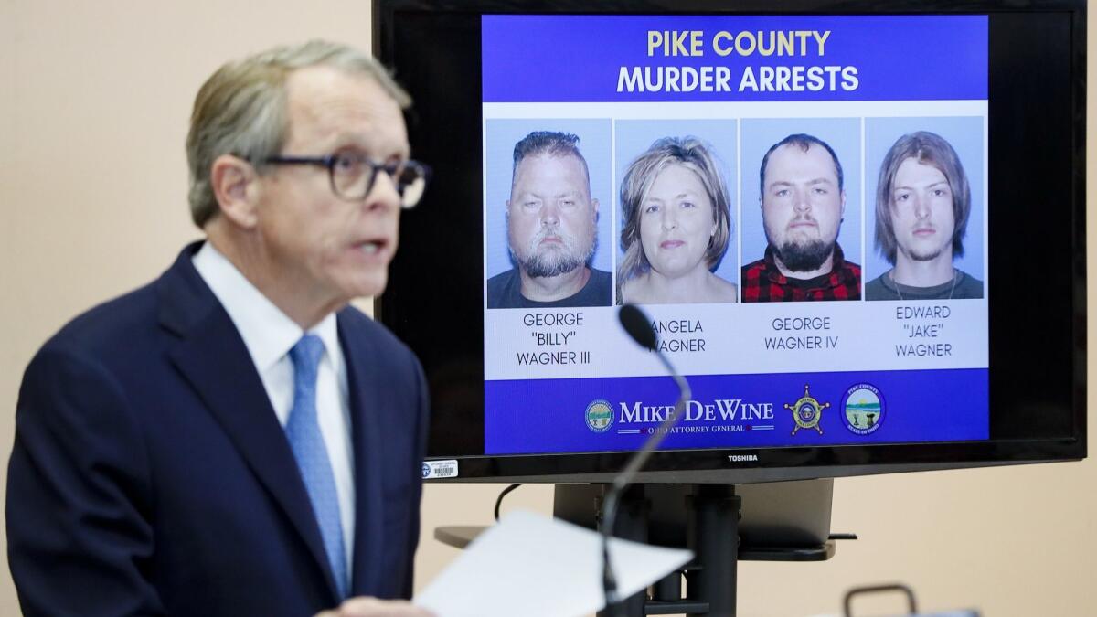 Ohio Atty. Gen. Mike DeWine speaks alongside a display of those arrested during a news conference on Tuesday, in Waverly, Ohio.