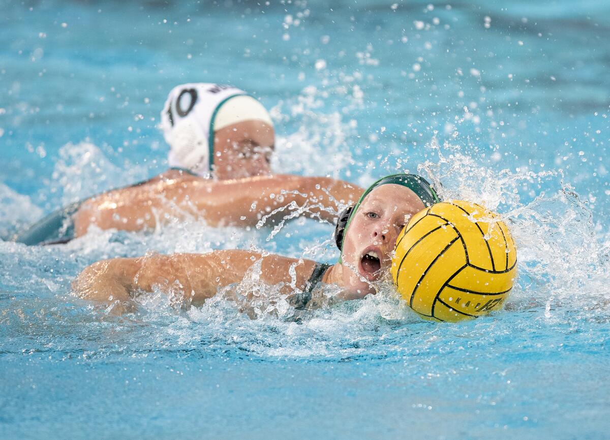 Costa Mesa's Adelaide Juelfs beats Aliso Niguel's Amanda McFadden on a breakaway during a CIF Division 3 playoff game.