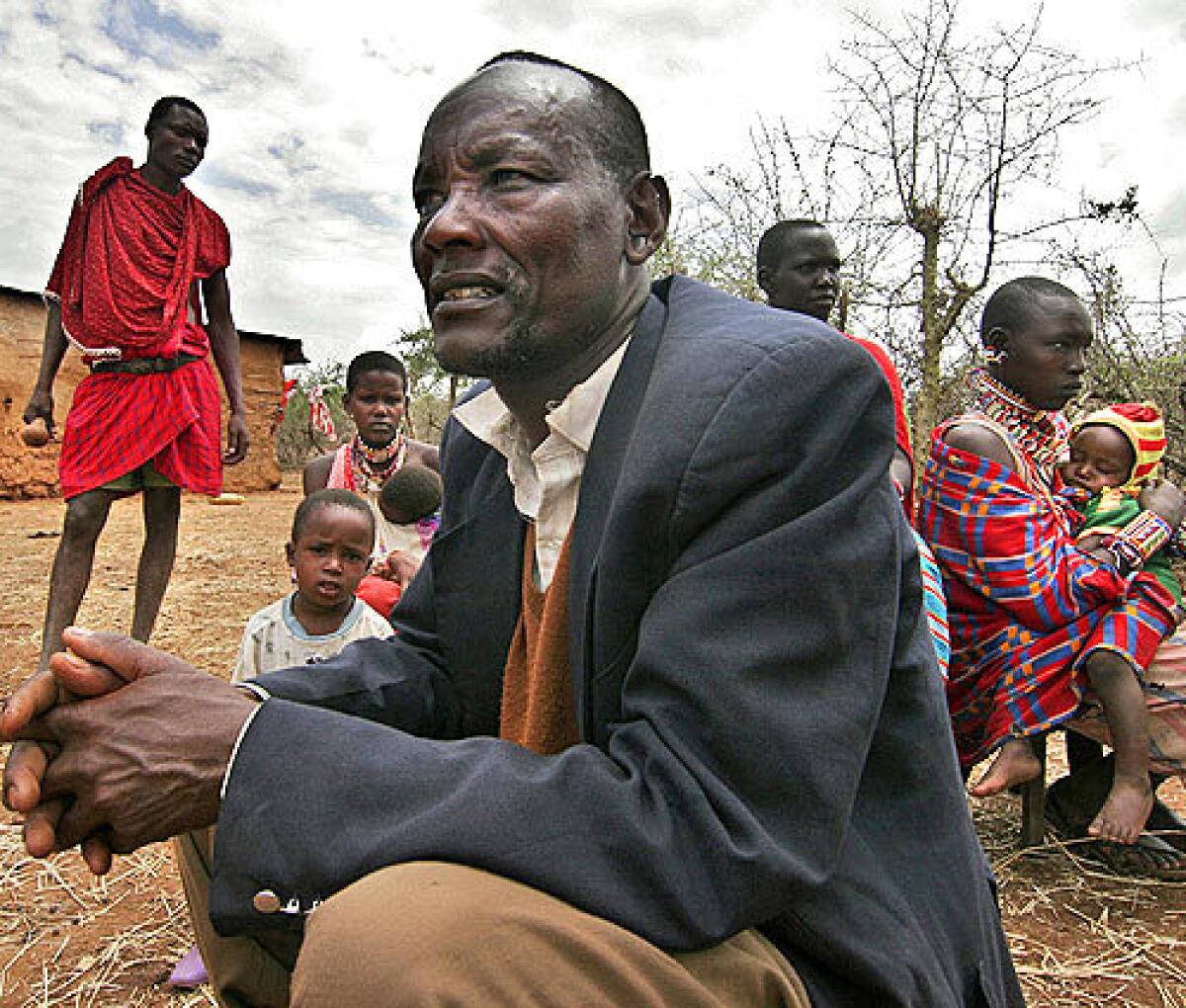 Soitanae Ole Kyoiogo, 47, a Masai herdsman, lives with his family outside of his home near Kajiado, Kenya. Drought in East Africa has decimated the cattle population, the sole livelihood of many Masai people. Some fathers have resorted to marrying off their daughters as young as nine to receive a dowry including livestook to help replenish their stocks. Two of Soitanae's daughters, aged 10 and 9, ran away to a local boarding school to escape marriage.