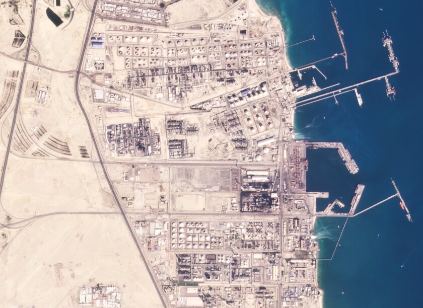 In this satellite photo from Planet Labs PBC, the Mina al-Ahmadi oil refinery is seen on Wednesday, Jan. 12, 2021. A fire erupted in Kuwait during maintenance work at the oil refinery on Friday, Jan. 14, 2021, killing two workers and critically injuring five others, the Kuwait National Petroleum Company said. (Planet Labs PBC via AP)