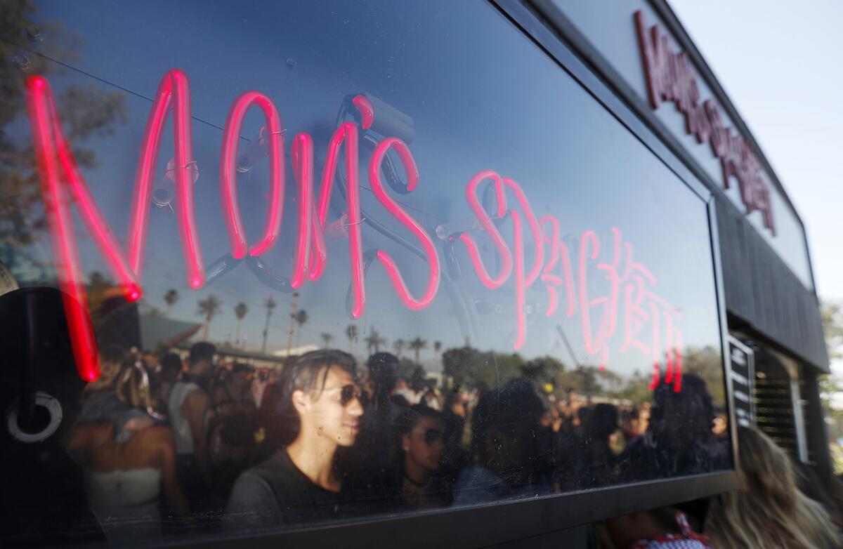 A line forms at rapper Eminem's Mom's Spaghetti booth at the Coachella Music and Arts Festival.