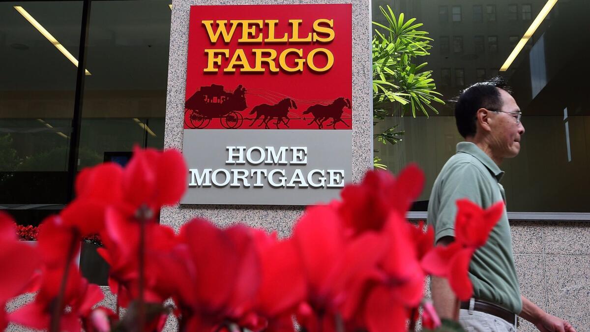 A former Wells Fargo mortgage banker has filed a wrongful termination lawsuit against the bank, saying he was scapegoated for the bank's bad practices.
