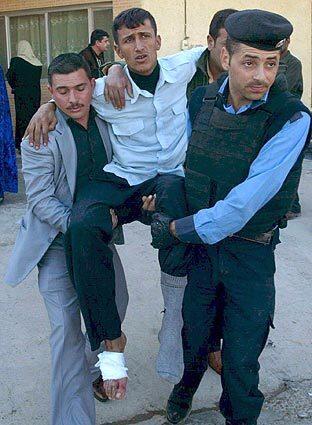 An injured man is transferred to a hospital in Kirkuk, in northern Iraq, after a suicide bomber struck at the Abdullah restaurant a few miles outside the city. At least 50 people were killed in the attack, the most deadly violence in Iraq in months.