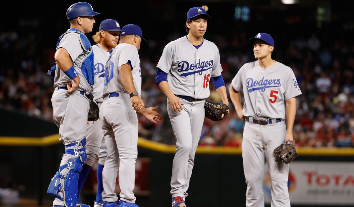 Dodgers pitcher Kenta Maeda (18) is removed by Manager Dave Roberts during the fifth inning against the Arizona Diamondbacks on Sunday.