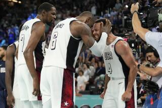 American LeBron James clutches Steph Curry's head and screams while Kevin Durant looks on 