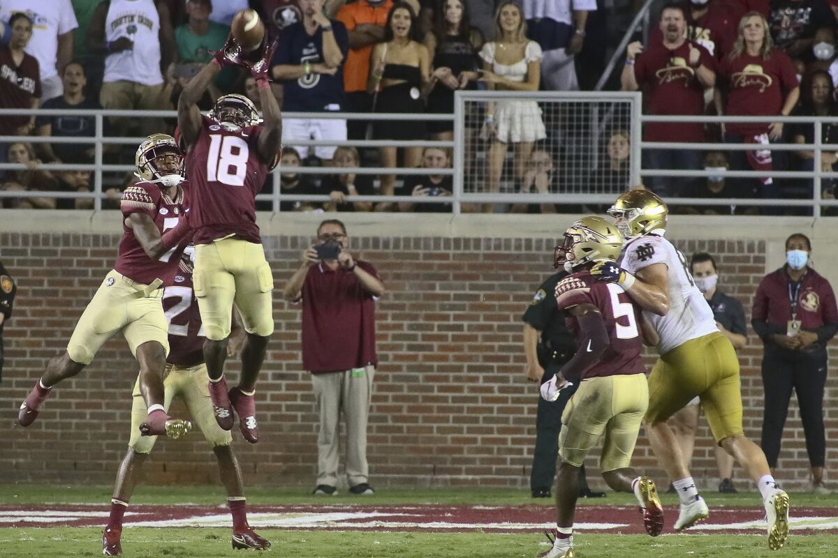 Florida State defensive back Travis Jay (18) intercepts a pass at the end of the fourth quarter of an NCAA college football game against Notre Dame Sunday, Sept. 5, 2021, in Tallahassee, Fla. Notre Dame won 41-38 in overtime. (AP Photo/Phil Sears)