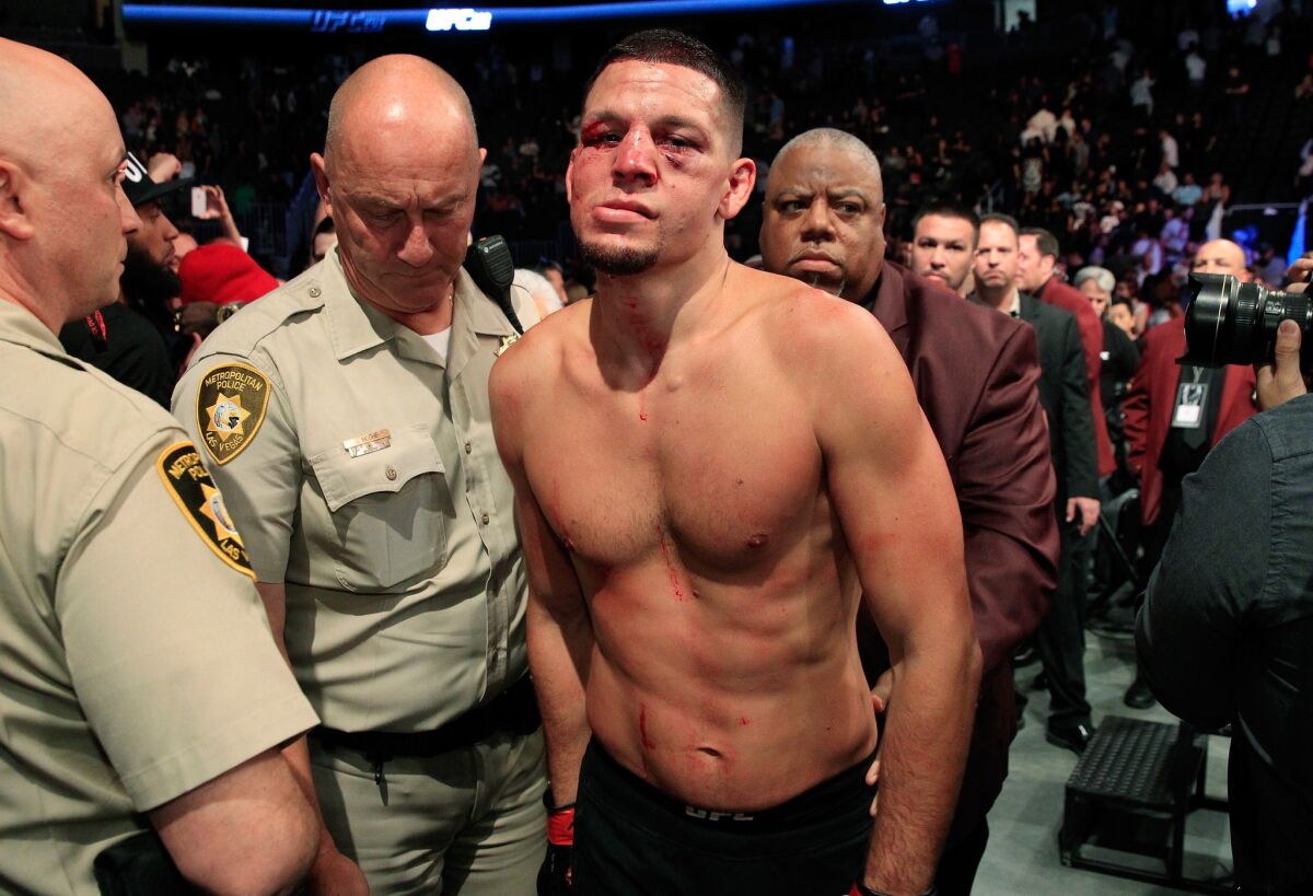 Nate Diaz leaves the octagon after his majority-decision loss to Conor McGregor at UFC 202 on Saturday.