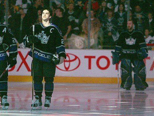 Kings left wing Luc Robitaille looks out over the crowd for the last time before playing his final home game.