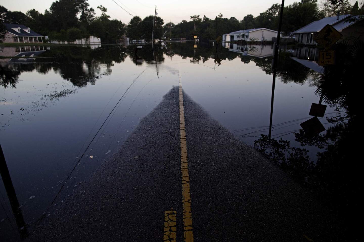 Standing water closes roads in Sorrento, La., on Aug. 20, 2016.