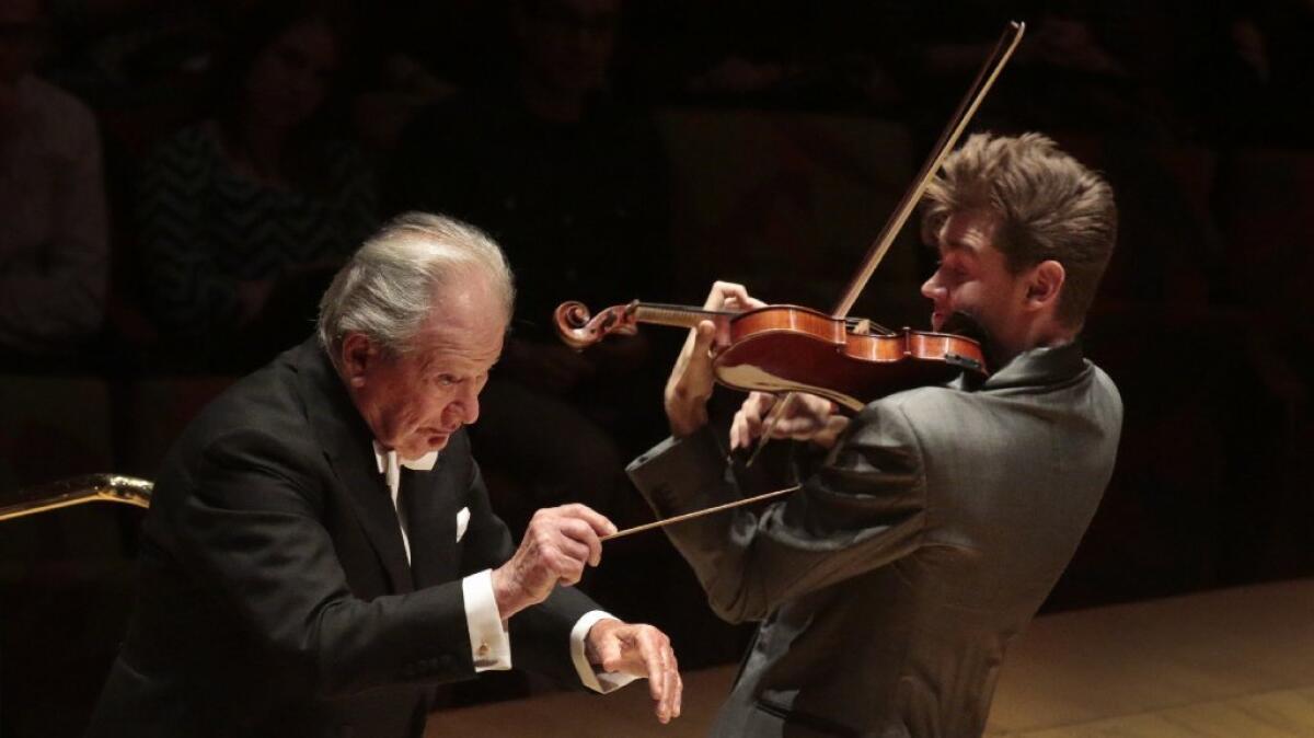 Neville Marriner leads the Colburn Orchestra, with violin soloist Blake Pouliot, at Walt Disney Concert Hall on Sunday.