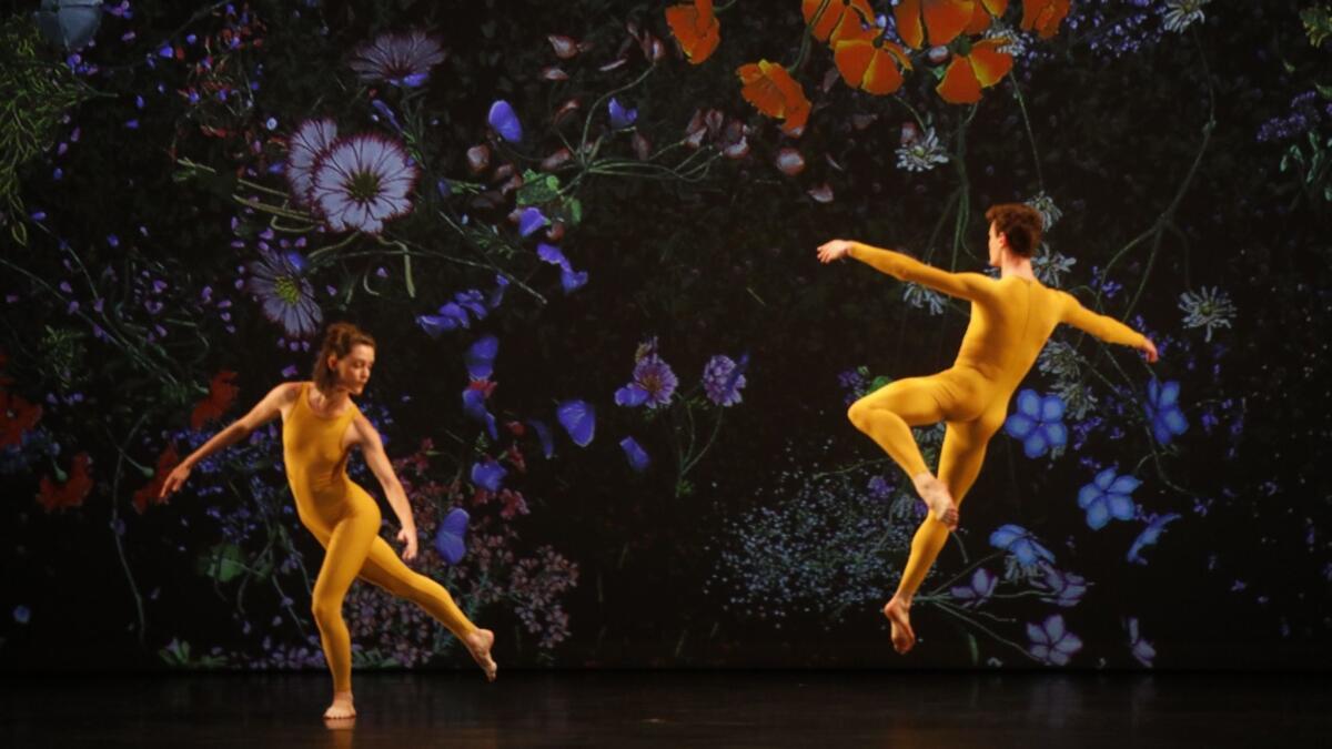 Dancers Vanessa Knouse and Joshua Guillemot-Rodgerson perform during "Night of 100 Solos: A Centennial Event," a tribute to Merce Cunningham at Royce Hall at UCLA.
