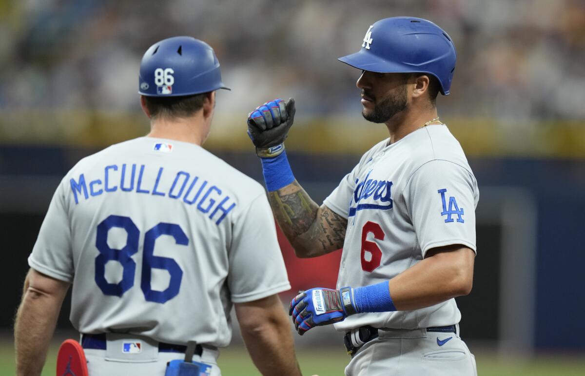 David Peralta, right, celebrates with first base coach Clayton McCullough after hitting a single in the fourth inning.