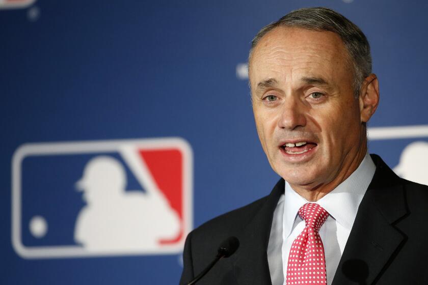 MLB Commissioner Rob Manfred talks during spring training media day in February.