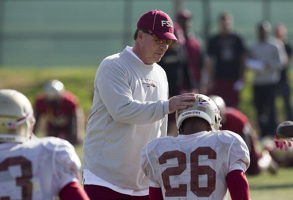 Florida State head coach Jimbo Fisher talks with defensive back P.J. Williams during practice at the Jack Hammett Sports Complex in Costa Mesa on Friday.