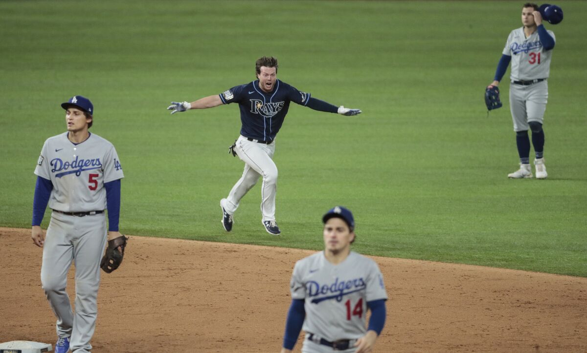 Tampa Bay's Brett Phillips dashes across the field after his game-winning hit against the Dodgers in the 2020 World Series.