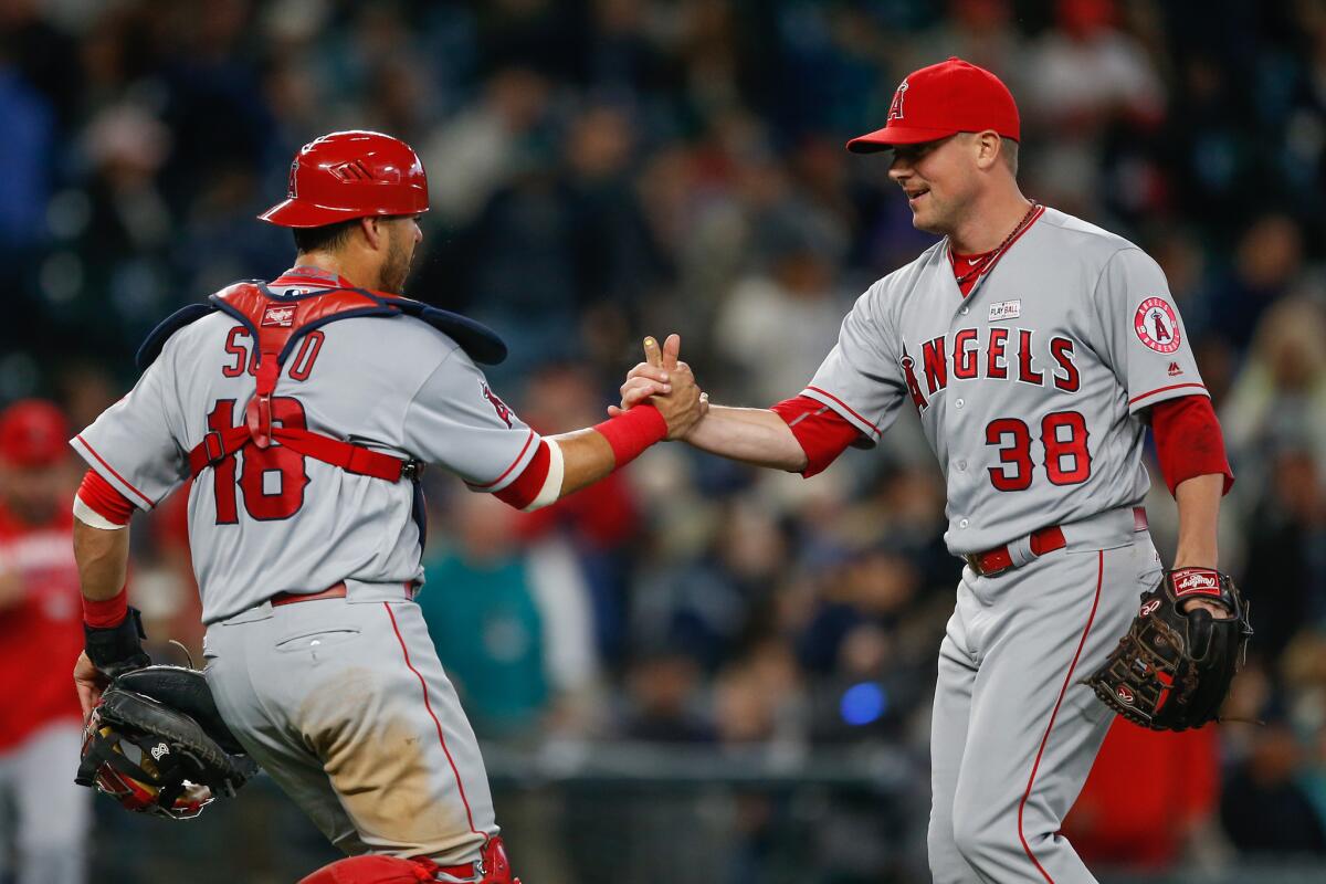 Geovany Soto, left, congratulates Joe Smith after an Angels win over Seattle on May 15.
