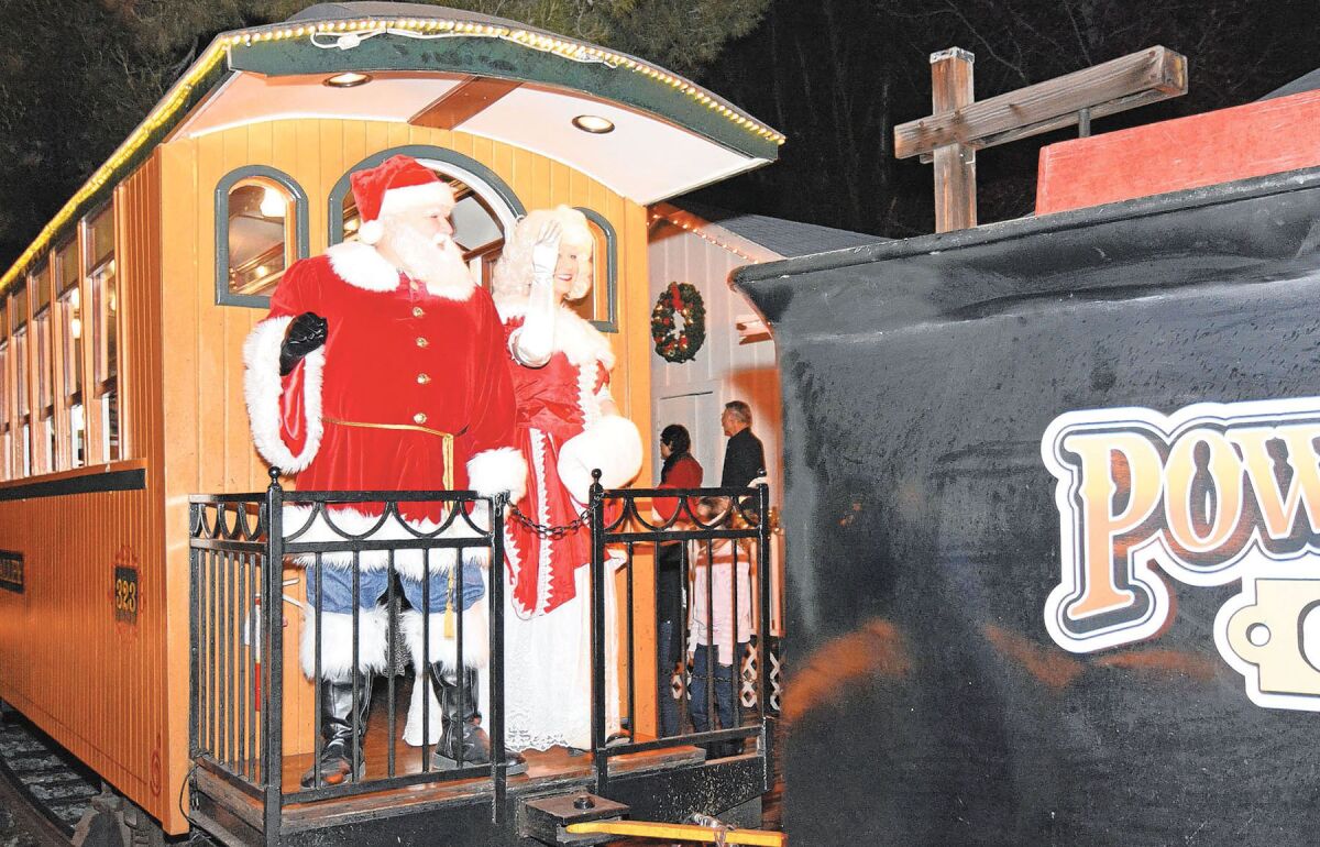 Santa and Mrs. Claus arriving via train at a previous "Christmas in the Park" in Poway.