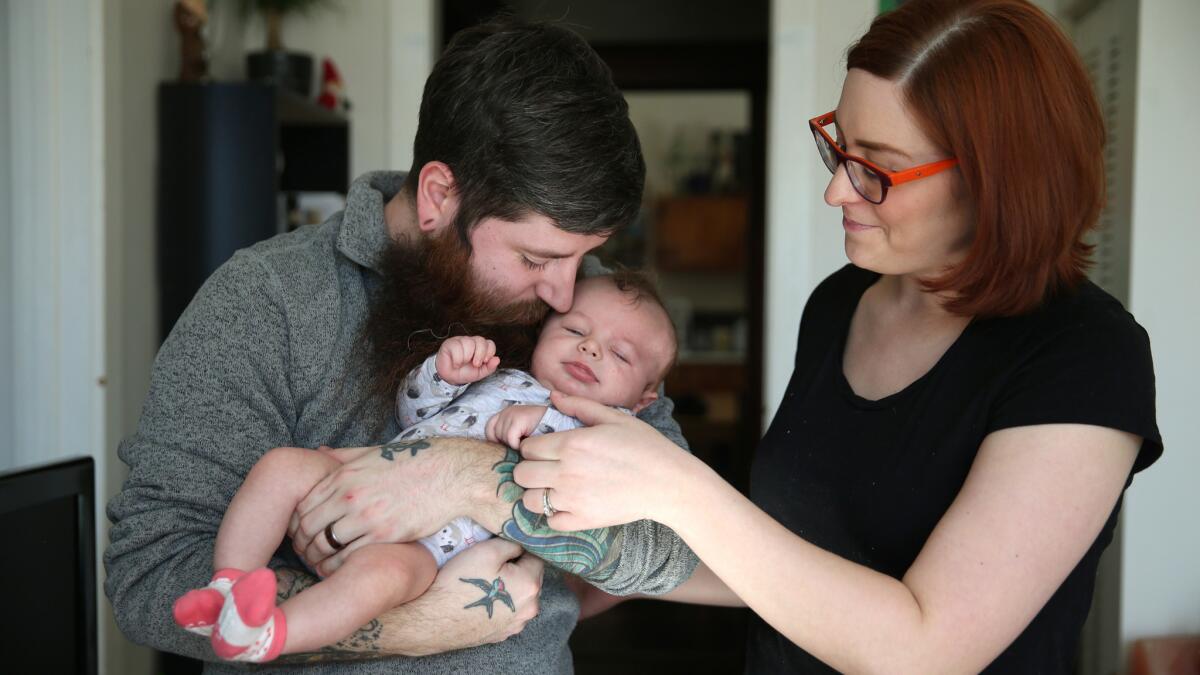 Patrice and Chris Bedford, with their 6-week-old son, Theodore, plan to move out of Chicago around July. Growing numbers of people are leaving the city.