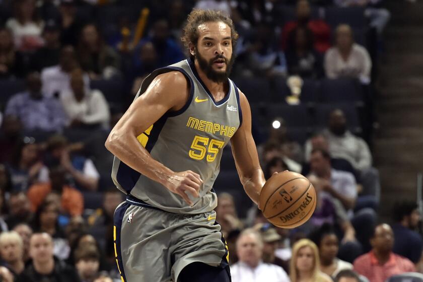 Memphis Grizzlies center Joakim Noah (55) brings the ball up court in the first half of an NBA basketball game against the Minnesota Timberwolves Saturday, March 23, 2019, in Memphis, Tenn. (AP Photo/Brandon Dill)
