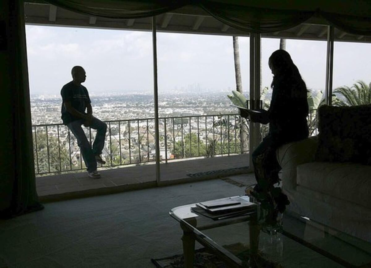 The wide-open view sold Art Copper, left, and wife Kandee on their Baldwin Hills Estates home.