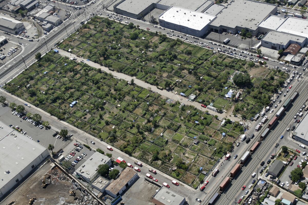 A unanimous City Council vote paves the way for warehouses and offices to be built on a 14-acre site on Alameda Street once known as the South Central Farm.